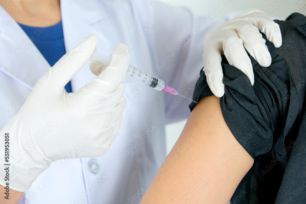 Hands of doctor injecting vaccination at hospital to those who received the vaccine Health and medical concept Hands of doctor injecting vaccination at hospital to those who received the vaccine Health and medical concept