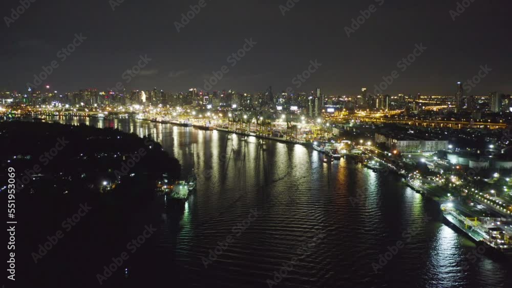 Aerial view of petrochemical oil refinery and sea in industrial engineering concept in Bangna district at night, Bangkok City, Thailand. Oil and gas tanks pipelines in industry. Modern metal factory. Aerial view of petrochemical oil refinery and sea in industrial engineering concept in Bangna district at night, Bangkok City, Thailand. Oil and gas tanks pipelines in industry. Modern metal factory.