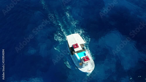 Aerial view of fishing boat traveling in Koufonisi Island Greece photo