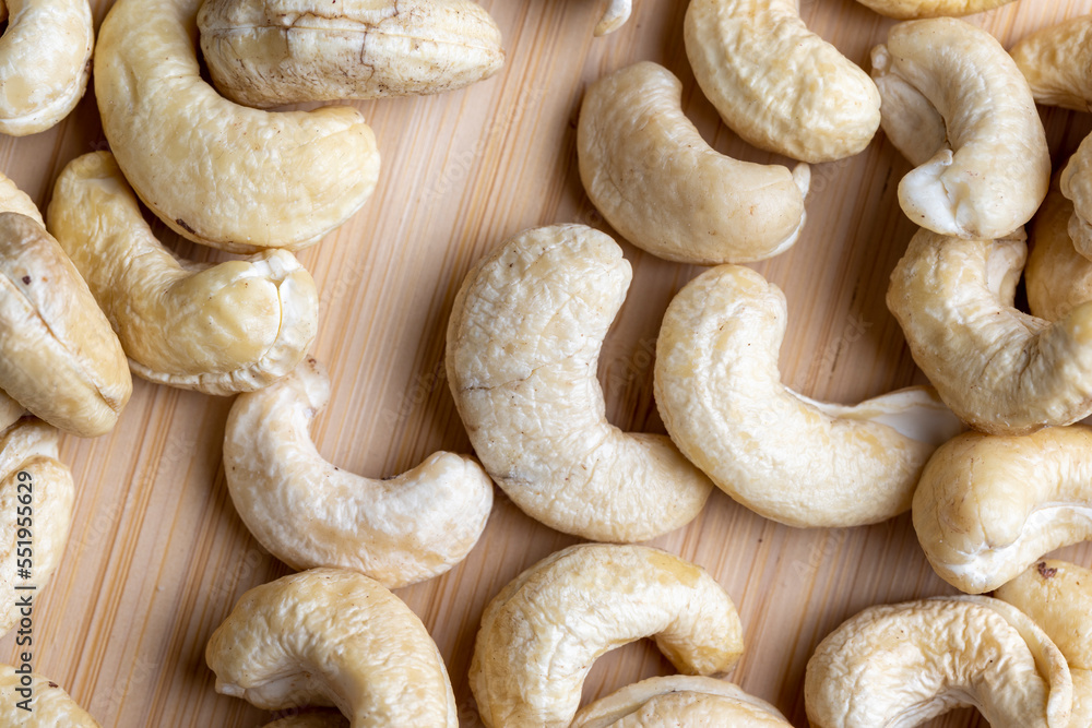 Hard roasted and peeled cashew nuts on the table Hard roasted and peeled cashew nuts on the table
