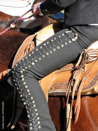 close up of a charro- mexican cowboy on a horse photo