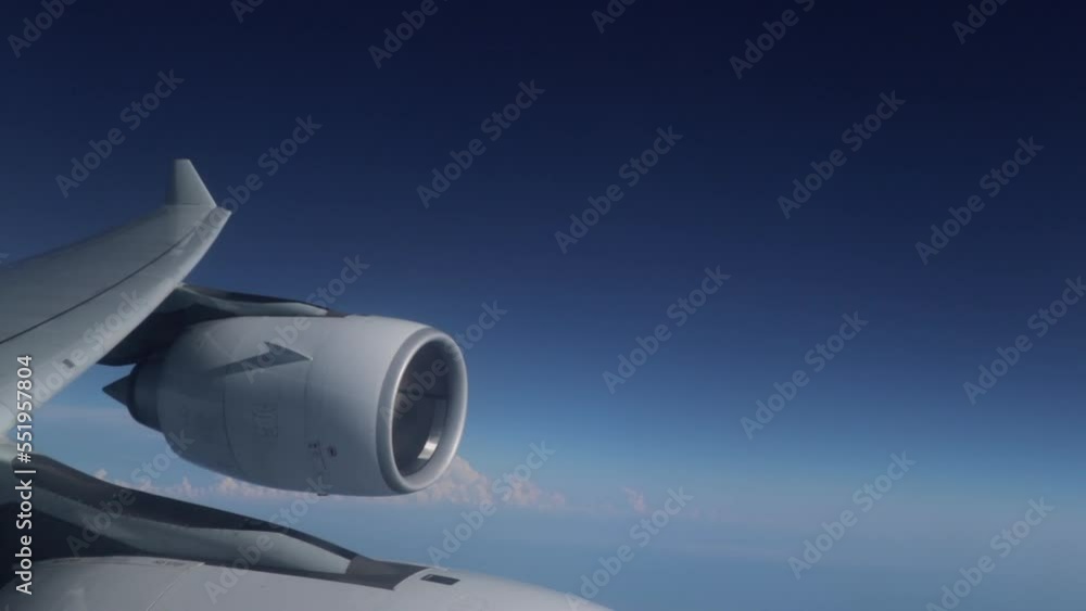 Plane Engine On Wing Against Blue Skies Plane Engine On Wing Against Blue Skies