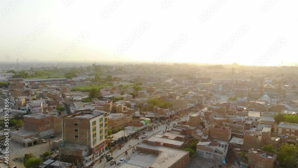 Aerial View Of Rohri City With Sun Setting On Horizon In Pakistan. Descending Shot Aerial View Of Rohri City With Sun Setting On Horizon In Pakistan. Descending Shot