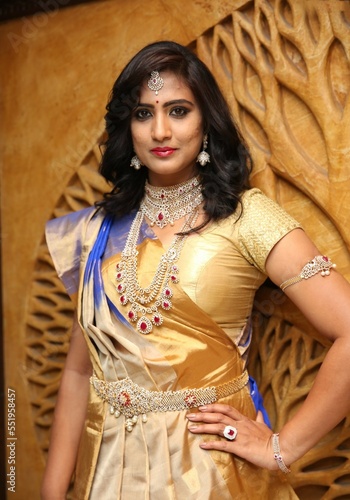young lady set of necklace, earrings and waist chain. indian fashion model photo