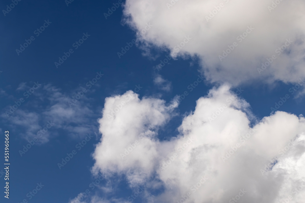 Clouds floating across the sky in the daytime Clouds floating across the sky in the daytime