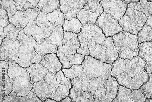 Drought of ground with natural cracked texture white grey background