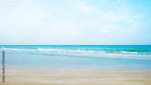 Scene of HuaHin beach with small wave and blue sky background. 