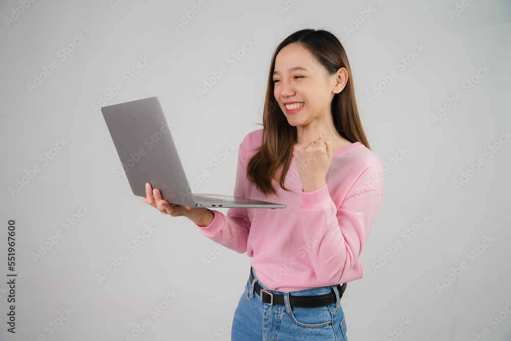 Asian girl holding laptop on white background Asian girl holding laptop on white background