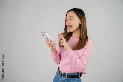 Asian girl holding laptop on white background