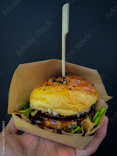 Hamberger on hand with white background, Fast food.