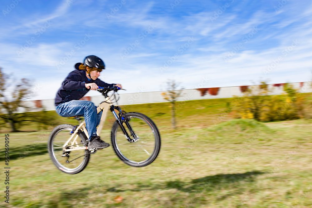 boy jumping at the dirtbike parcour in Munich boy jumping at the dirtbike parcour in Munich