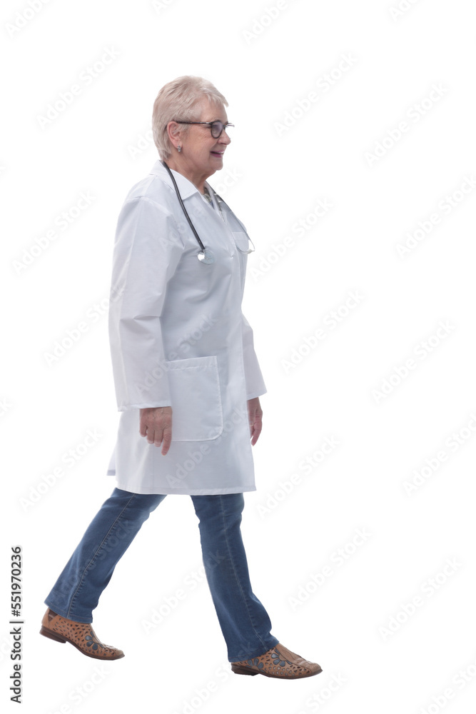in full growth. experienced female doctor walking towards you in full growth. experienced female doctor walking towards you