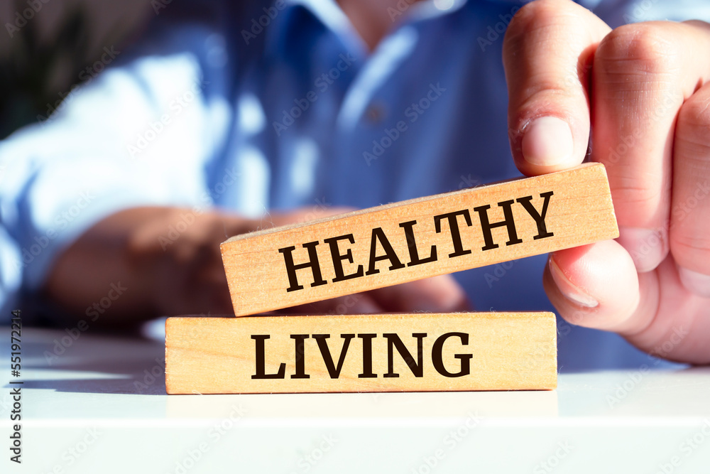 Healthy Living text concept written on wooden blocks lying on a table