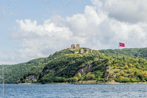 Seascape of Bosporus Strait with Yoros castle on mountain top in background.