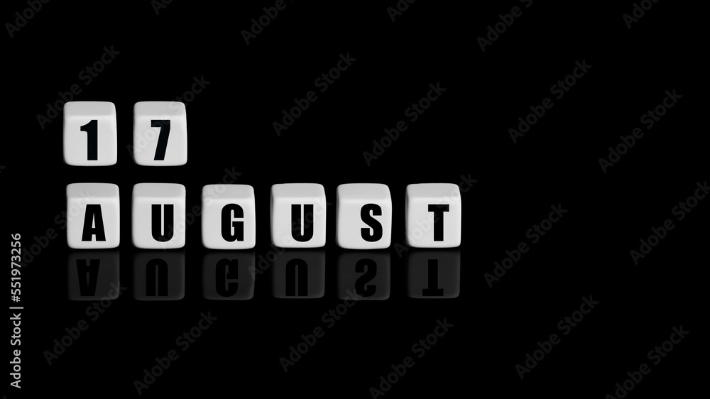August 17th. Day 17 of month, Calendar date. White cubes with text on black background with reflection. Summer month, day of year concept August 17th. Day 17 of month, Calendar date. White cubes with text on black background with reflection. Summer month, day of year concept