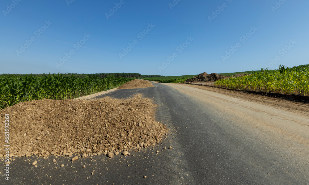 Naklejka premium Construction and repair of a new highway in rural areas