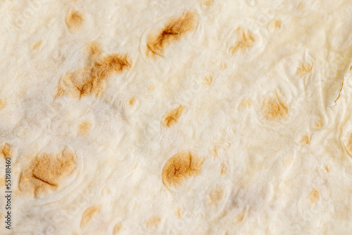 Wheat pita bread with dark spots