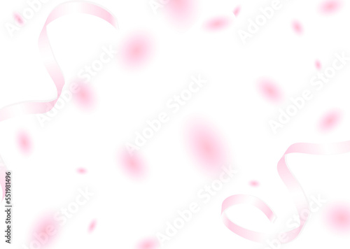 風に舞うピンクの花びらとリボン