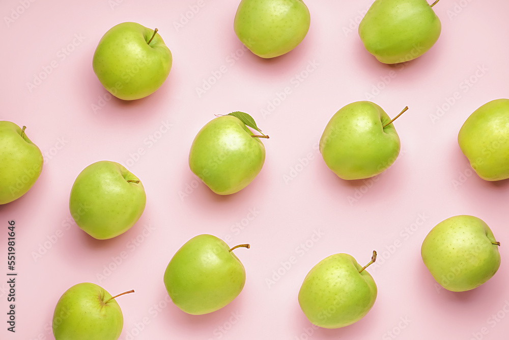 Ripe green apples on pink background Ripe green apples on pink background