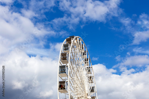 Ferris wheel against the sky and clouds