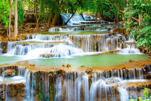 Amazing colorful waterfall in national park forest during spring beautiful deep forest in Thailand technic long exposure  during vacation and relax time.