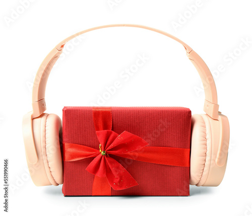 Headphones with Christmas gift on white background