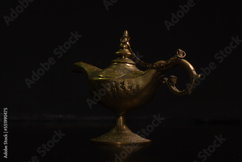 Aladdin's magic lamp isolated on black background