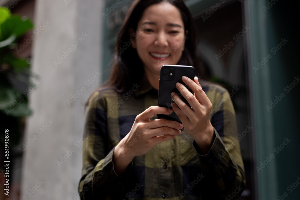 woman using cell phone hand holding mobile texting message contact us.chatting,search internet information in office.technology device communication connecting woman using cell phone hand holding mobile texting message contact us.chatting,search internet information in office.technology device communication connecting