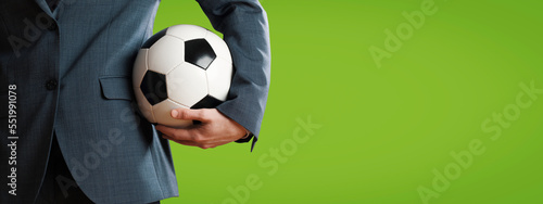 Manager holding a soccer ball photo