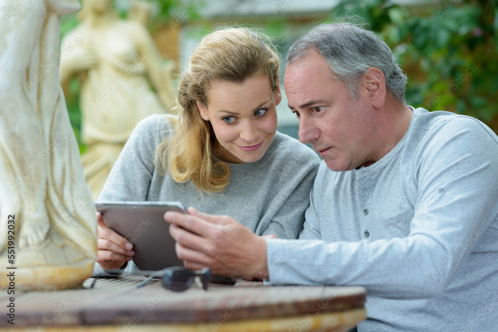 client looking at landscaping samples in the internet client looking at landscaping samples in the internet