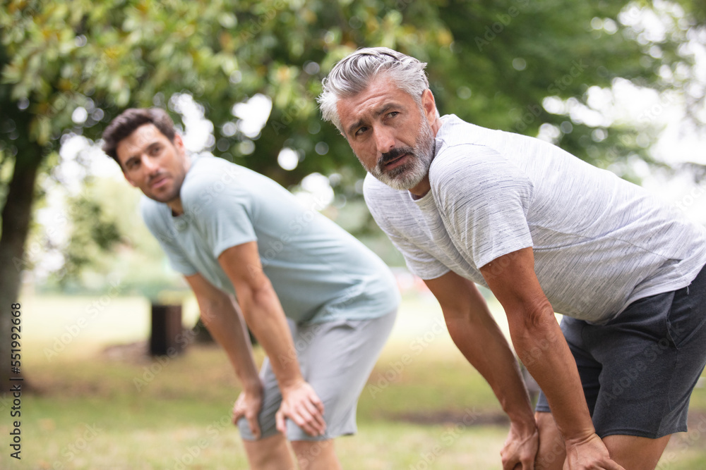 portrait of cheerful men running outdoors portrait of cheerful men running outdoors