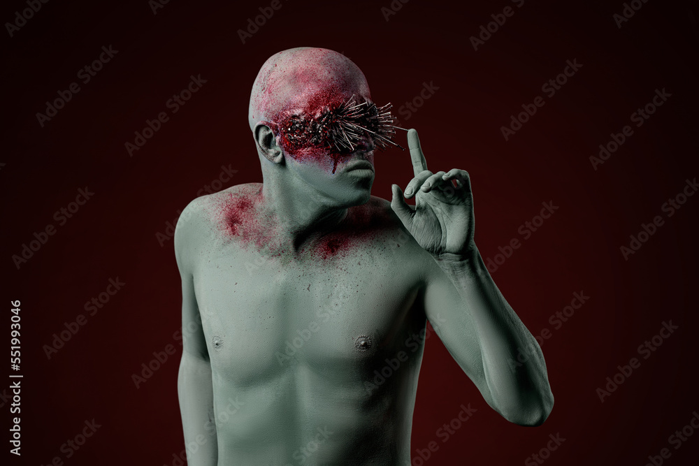 Demon man with spikes on the eyes. Halloween concept makeup Demon man with spikes on the eyes. Halloween concept makeup