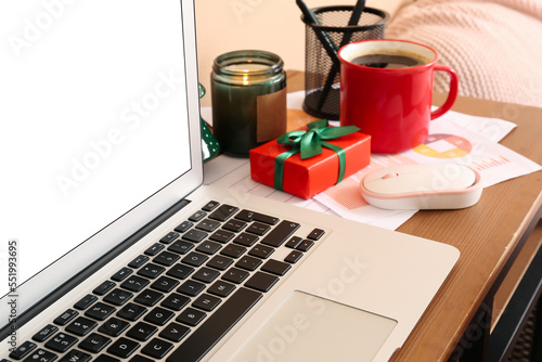 Laptop with Christmas gift ...