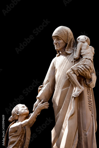 Mother Teresa statue with poor children,  Saint Mother Teresa of Calcutta photo