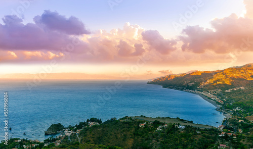 travel landscape scenic picture of beautiful highland mountain town in sunrise or sunset with sea shore on background