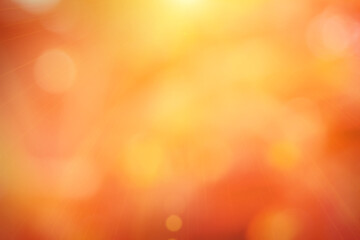 Natural background blurring warm colors and bright sun light. Bokeh or Christmas background Green Energy at sky sunny color orange light patterns plain abstract flare evening clouds blur.	