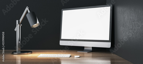 Modern designer wooden desktop with empty white mock up computer monitor, lamp and keyboard. 3D Rendering.