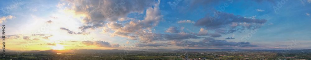 Aerial view of the sunset sky, Panoramic beautiful landscape with  twilight sky, Sun bursting through clouds.