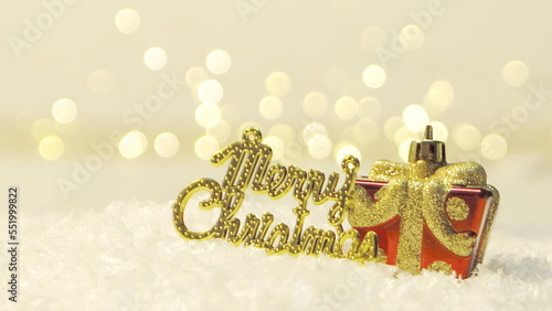 Golden merry christmas text with bokeh lights in the background