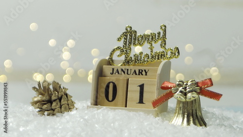 Golden merry christmas text with bokeh lights in the background