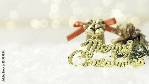 Golden merry christmas text with bokeh lights in the background