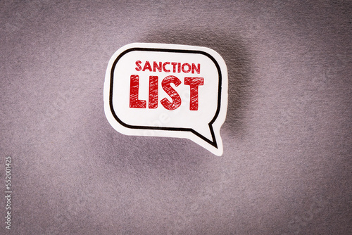 SANCTION LIST. Speech bubble with text on gray background