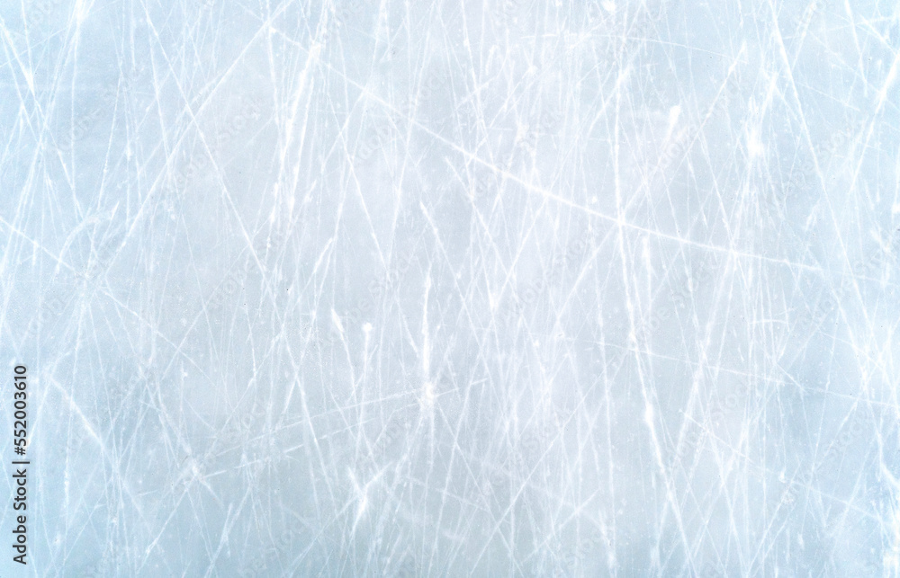 Fototapeta premium Ice texture, top view of scratched snowy ice of the rink