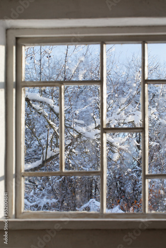 old window with snowy beautiful landscape
