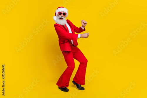 Full length portrait of funky grandfather have good mood dancing isolated on yellow color background