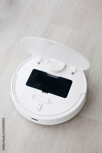 smart home concept, remote control of a robot vacuum cleaner via the Internet and detection of kitchen pollution by artificial intelligence