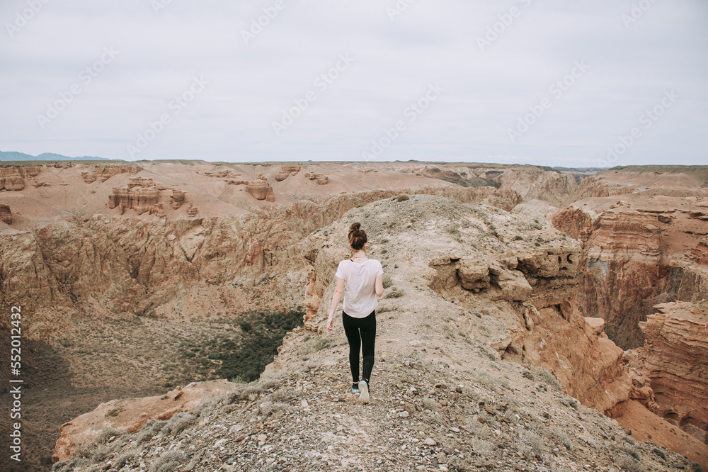girl walks along the canyon, cliff, height, beauty, summer