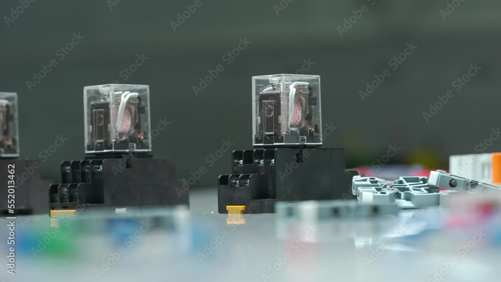 Relay with coils of direct and alternating current on