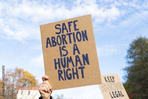 Photos Protesters holding signs with slogans Safe abortion is a human right and Keep abortion legal