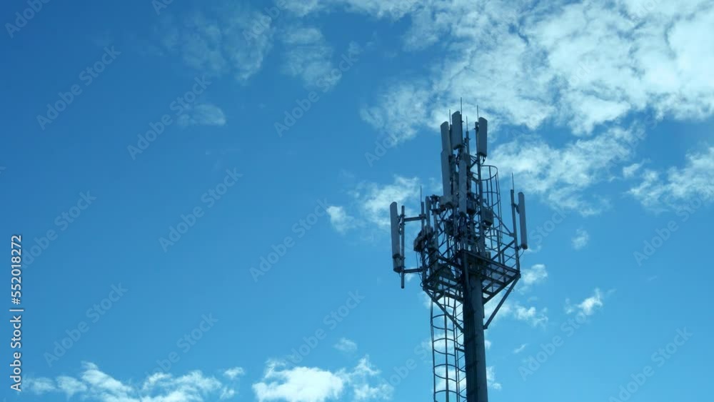 Mobile Communication Cellular Tower Close-up, 3G 4G 5G Transmitter, Cell Tower and Beautiful Time Lapse of Nature, Blue Sky and White Clouds 4K.